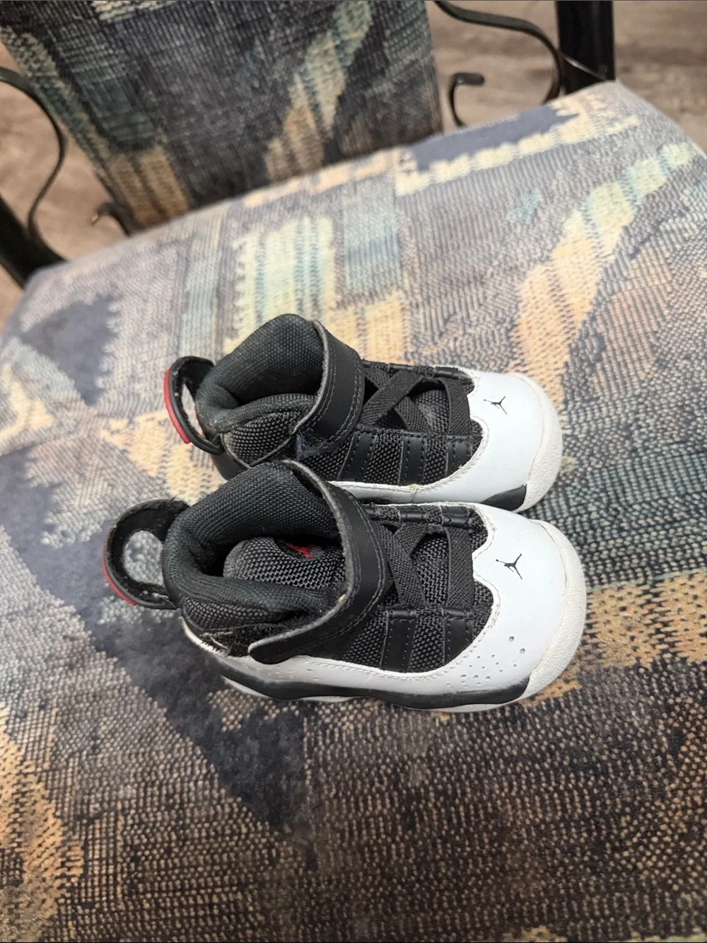Jordan Kids Black and White High-Top Sneakers with Red Accent